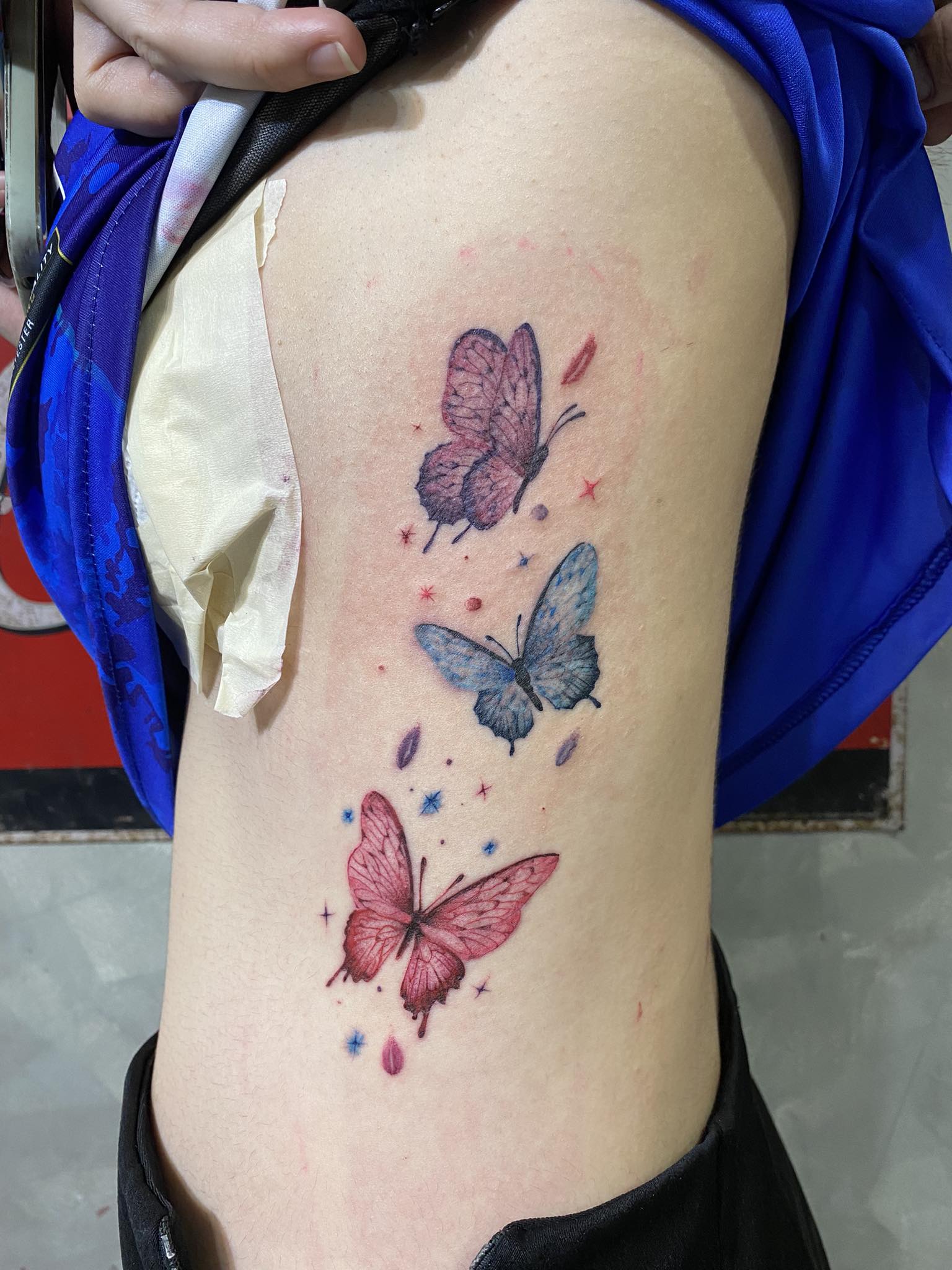 Butterfly, Color, Rib Tattoo by Max. He is a highly skilled tattoo artist at Lethal Ink Tattoo in Pattaya. He is celebrated for is expertise in black and grey, anime, manga, Thai art, and tribal motifs. Max, Butterfly, Color, Rib Tattoo, Lethal Ink, Pattaya, 2024