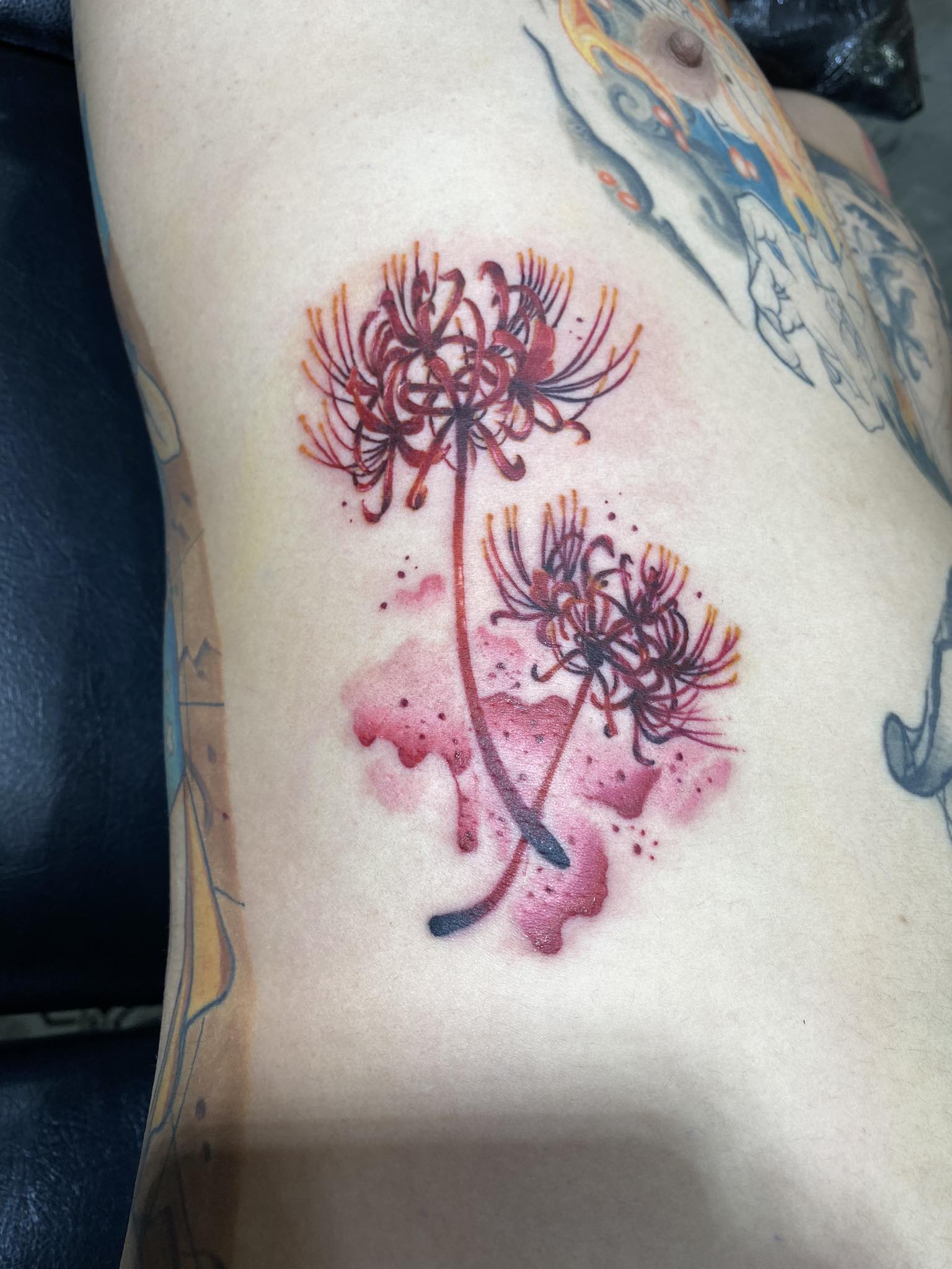 Flower, Red, Rib, Color Cadillac, City Scape, Cool, Black and Grey Tattoo by Max. He is a highly skilled tattoo artist at Lethal Ink Tattoo in Pattaya. He is celebrated for is expertise in black and grey, anime, manga, Thai art, and tribal motifs. Max, Flower, Red, Rib, Color Tattoo, Lethal Ink, Pattaya, 2024