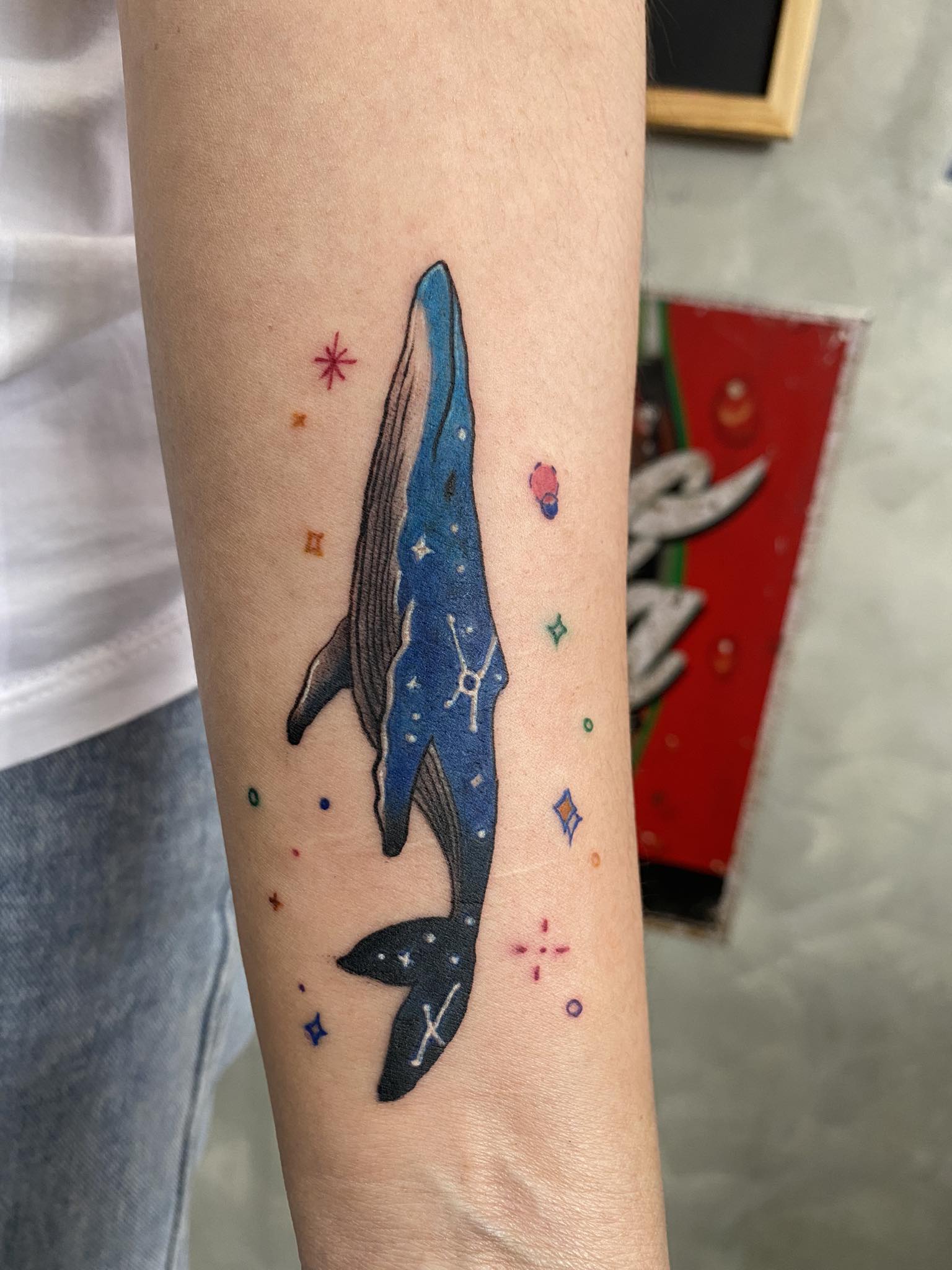 Whale, Color, Forearm Tattoo by Max. He is a highly skilled tattoo artist at Lethal Ink Tattoo in Pattaya. He is celebrated for is expertise in black and grey, anime, manga, Thai art, and tribal motifs. Max, Whale, Color, Forearm Tattoo, Lethal Ink, Pattaya, 2024