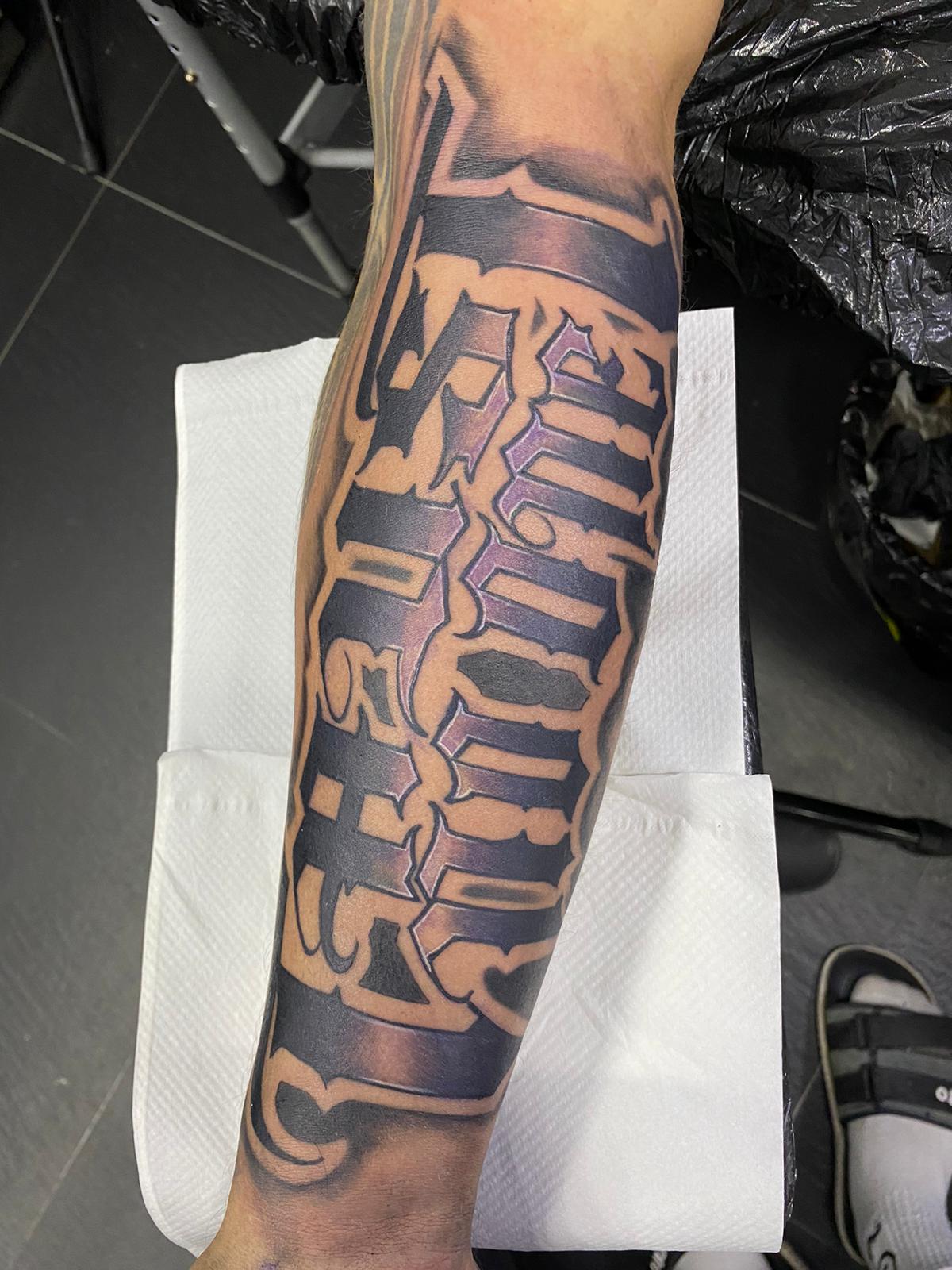 Trust, Black, Graffiti letters, Forearm Tattoo. We have highly skilled tattoo artists at Lethal Ink Tattoo in Pattaya. We are known for Japanese, Chicano, Realistic, New School, Old School, Neo Thai, Blackwork, and Bamboo Tattooing. Trust, Black, Graffiti letters, Forearm Tattoo, Lethal Ink, Pattaya, 2024