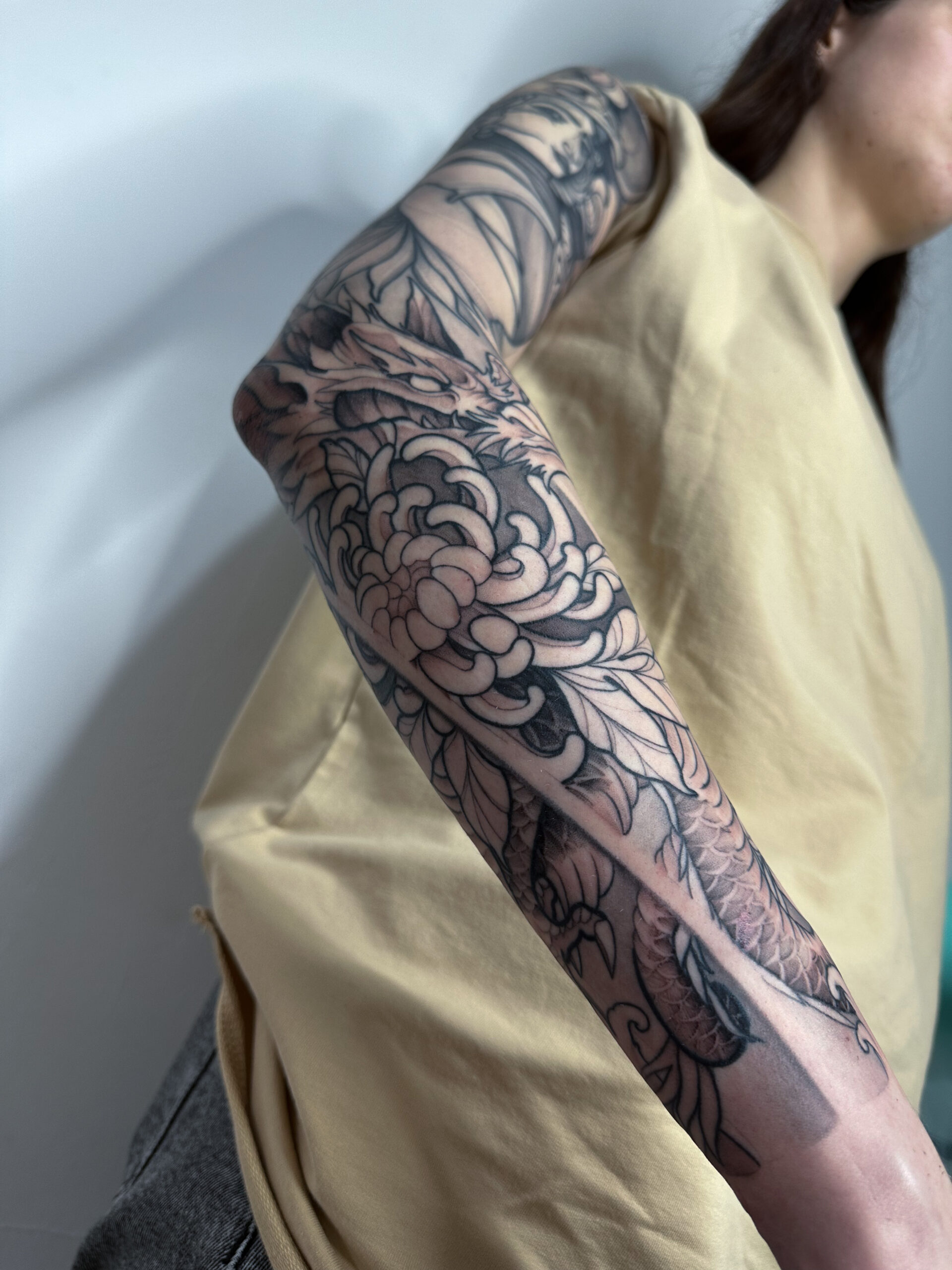 Japanese, Dragon, Blackwork, Full Arm Tattoo by Alek. She is a highly skilled tattoo artist at Lethal Ink Tattoo in Pattaya. She is celebrated for her expertise in Japanese, BlackWork, and Abstract styles. Alek, Japanese, Dragon, Blackwork, Full Arm Tattoo, Lethal Ink, Pattaya, 2024