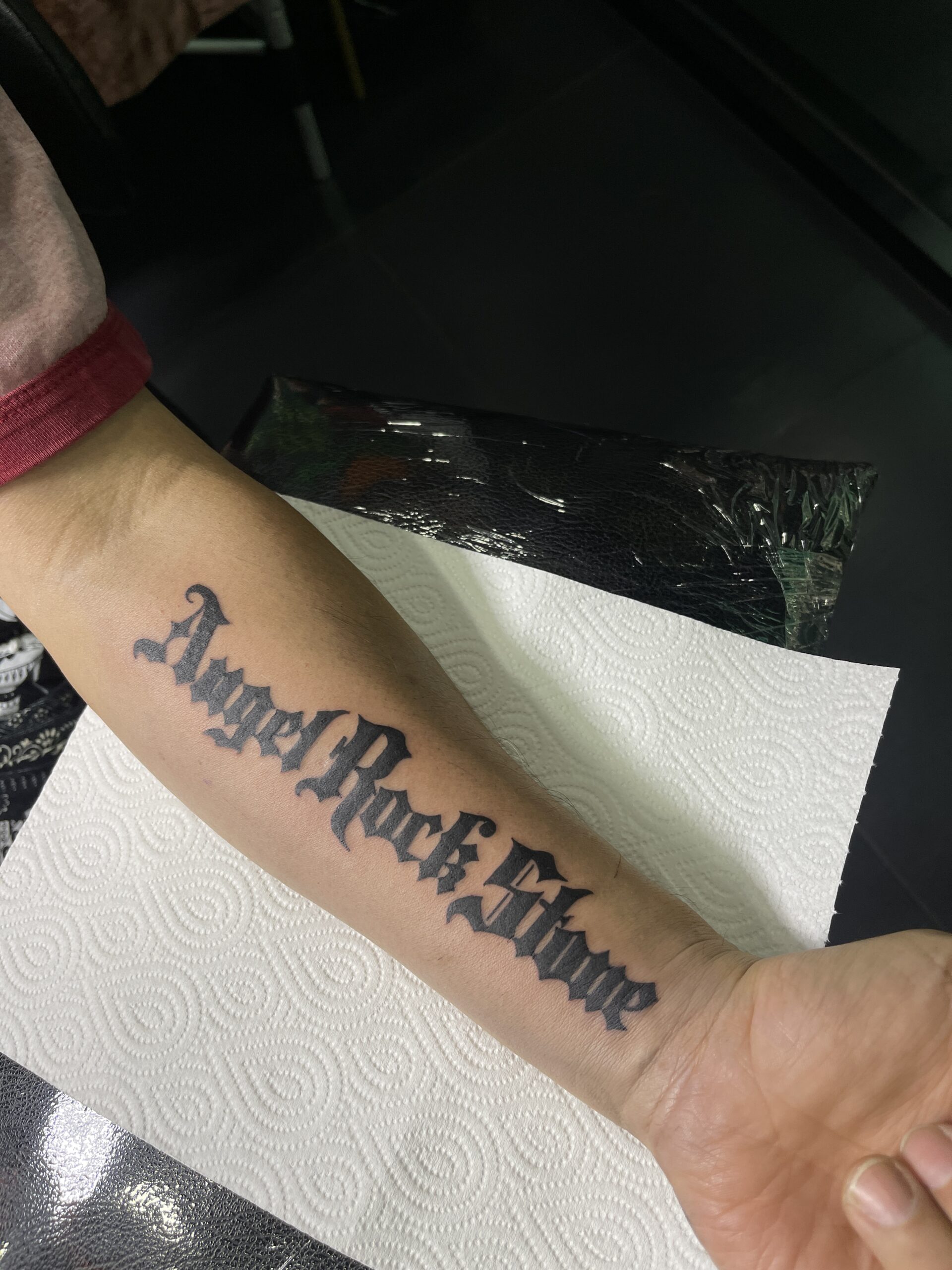 Black, Script, ForeArm Tattoo by Max. He is a highly skilled tattoo artist at Lethal Ink Tattoo in Pattaya. He is celebrated for his expertise in black and grey, anime, manga, Thai art, and tribal motifs. Max, Black, Script, ForeArm Tattoo, Lethal Ink, Pattaya, 2024
