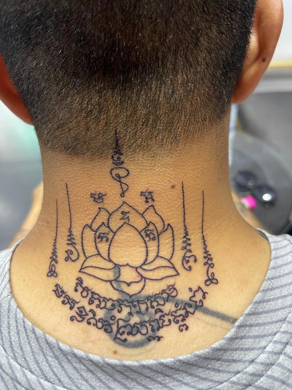 Sak Yant, Thai Traditional, Neck Tattoo by Toon. He is a highly skilled tattoo artist at Lethal Ink Tattoo in Pattaya. He is celebrated for is expertise in black and grey, anime, manga, Thai art, and tribal motifs. Toon, Sak Yant, Thai Traditional Neck Tattoo, Lethal Ink, Pattaya, 2024