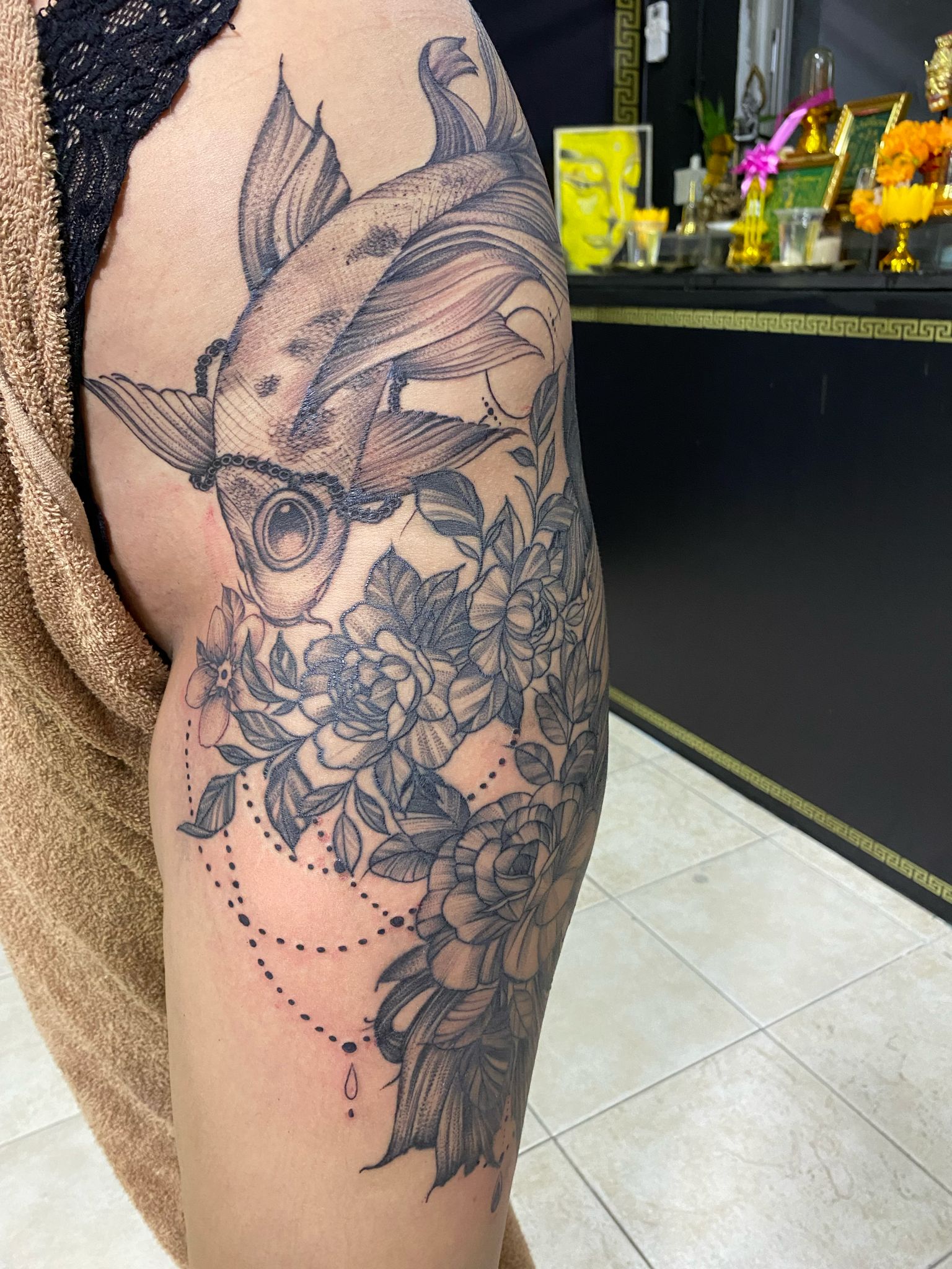 Black, Koi Fish, Hip Tattoo by Max. He is a highly skilled tattoo artist at Lethal Ink Tattoo in Pattaya. He is celebrated for his expertise in black and grey, anime, manga, Thai art, and tribal motifs. Max, Black, Koi Fish, Hip Tattoo, Lethal Ink, Pattaya, 2024