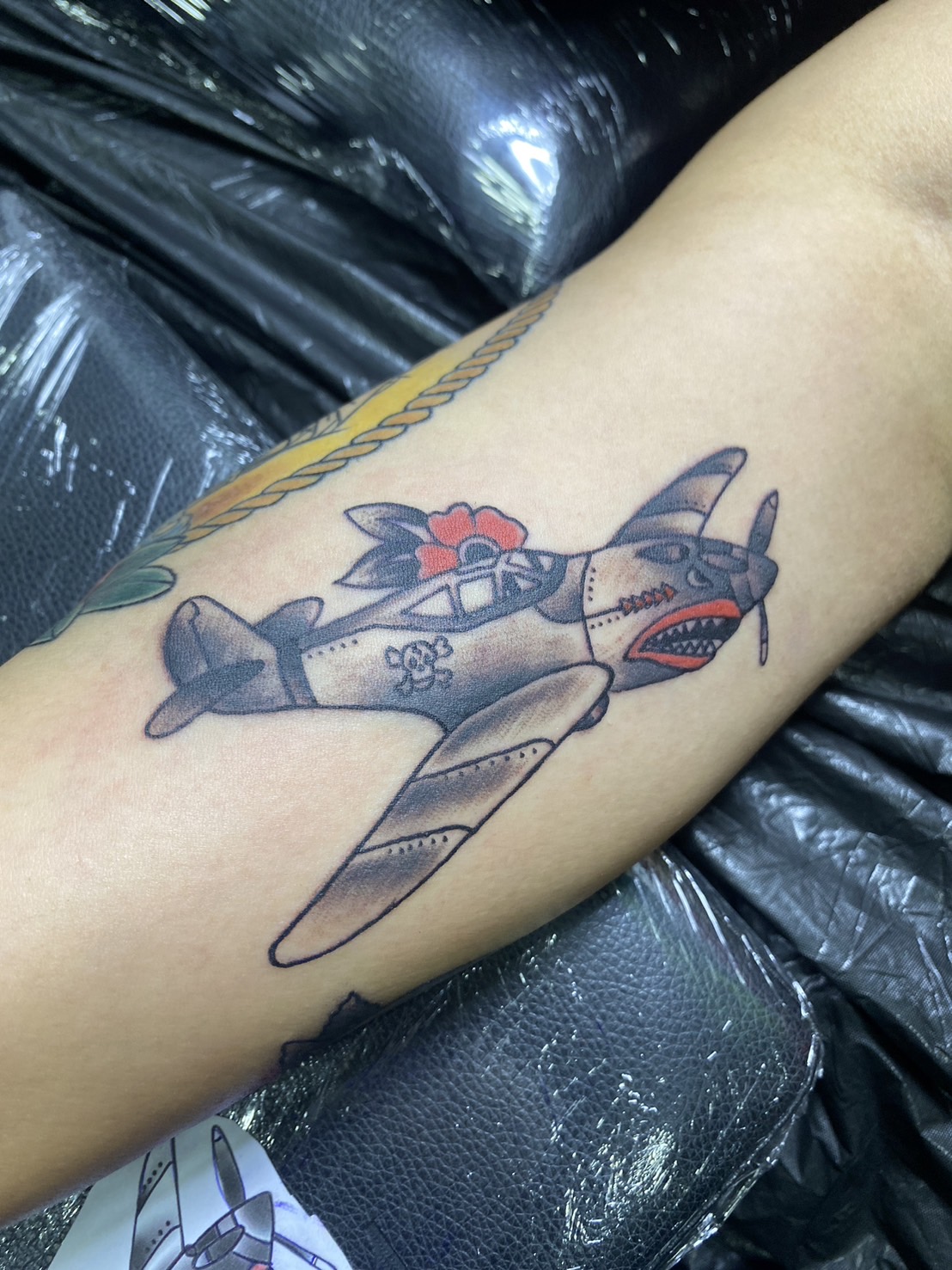 Airplane, Animated, Color, Arm tattoo by Max. He is a highly skilled tattoo artist at Lethal Ink Tattoo in Pattaya. He is celebrated for is expertise in black and grey, anime, manga, Thai art, and tribal motifs. Airplane, Animated, Color, Arm Tattoo, Max, Lethal Ink, Pattaya, 2024