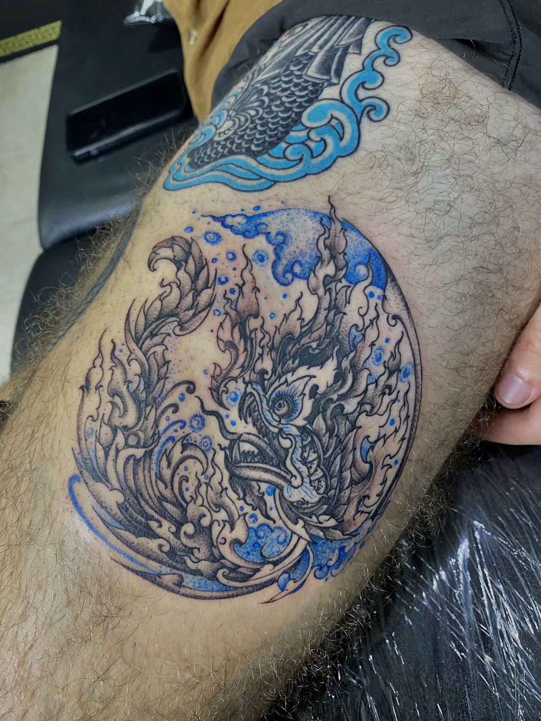 Dragon, Color, thigh tattoo by Max. He is a highly skilled tattoo artist at Lethal Ink Tattoo in Pattaya. He is celebrated for is expertise in black and grey, anime, manga, Thai art, and tribal motifs. Dragon, Color, thigh Tattoo, Max, Lethal Ink, Pattaya, 2024