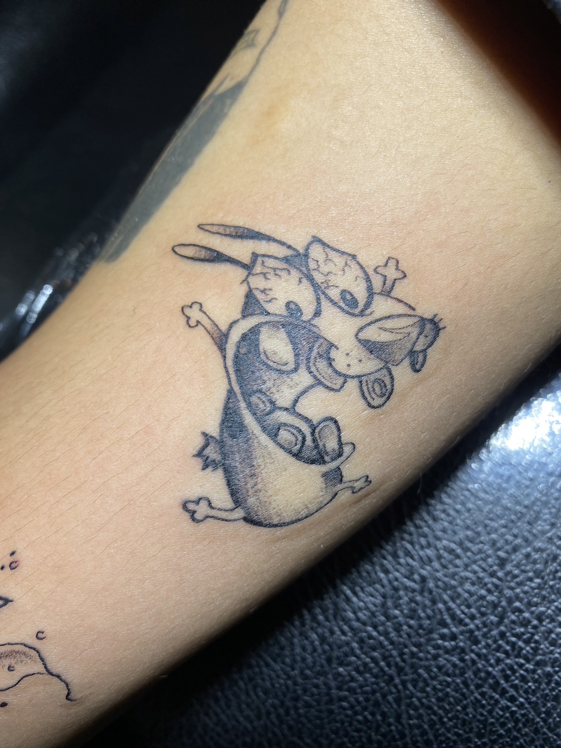 Ren, Cartoon, Black, Arm tattoo by Max. He is a highly skilled tattoo artist at Lethal Ink Tattoo in Pattaya. He is celebrated for is expertise in black and grey, anime, manga, Thai art, and tribal motifs. Ren, Cartoon, Black, Arm Tattoo, Max, Lethal Ink, Pattaya, 2024