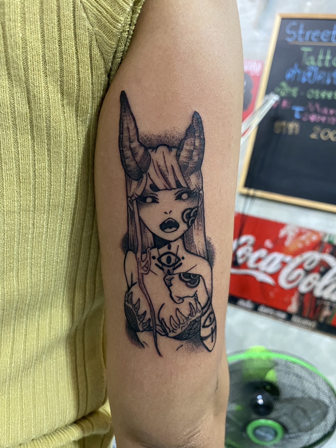 Sexy, Demon Girl, Black Tricep tattoo by Max. He is a highly skilled tattoo artist at Lethal Ink Tattoo in Pattaya. He is celebrated for is expertise in black and grey, anime, manga, Thai art, and tribal motifs. Sexy, Demon Girl, Black Tricep Tattoo, Max, Lethal Ink, Pattaya, 2024