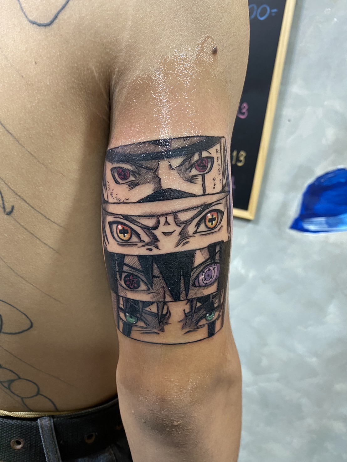 Anime, Face, Color, Tricep tattoo by Max. He is a highly skilled tattoo artist at Lethal Ink Tattoo in Pattaya. He is celebrated for is expertise in black and grey, anime, manga, Thai art, and tribal motifs. Anime, Face, Color, Tricep Tattoo, Max, Lethal Ink, Pattaya, 2024