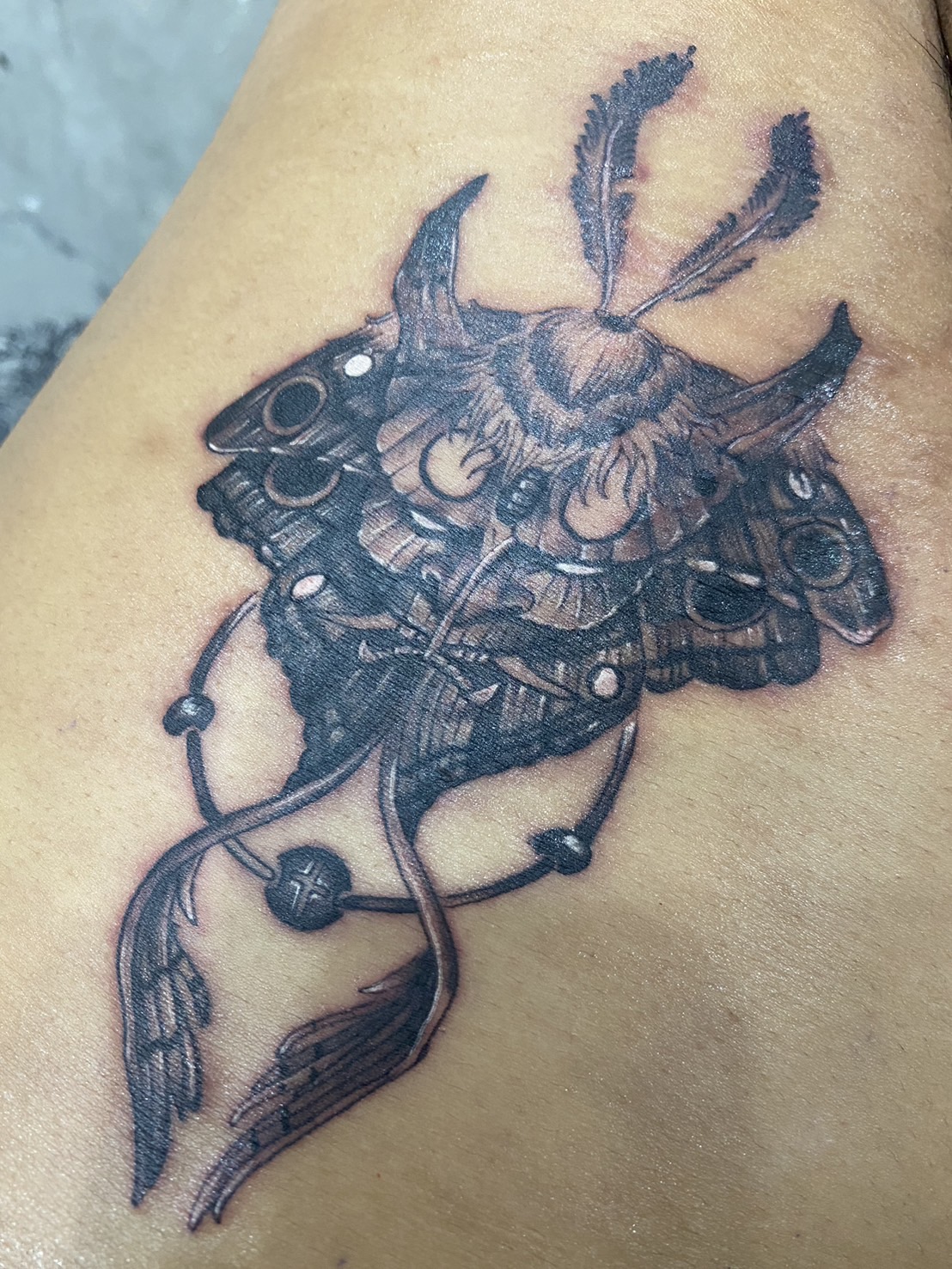 Demon, Mask, Black tattoo by Max. He is a highly skilled tattoo artist at Lethal Ink Tattoo in Pattaya. He is celebrated for is expertise in black and grey, anime, manga, Thai art, and tribal motifs. Demon, Mask, Black Tattoo, Max, Lethal Ink, Pattaya, 2024