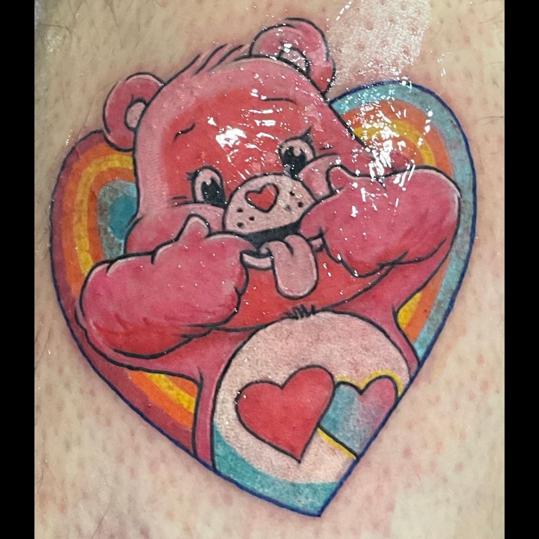 CareBear, Couples, Color Tattoo by Ron. He is a highly skilled tattoo artist at Lethal Ink Tattoo in Pattaya. He is Known for is expertise in Watercolor Fine Line, Tribal, Realistic, Irezumi, Neo Thai, Quote, Japanese, and Blackwork. Ron, Tattoo Artist, Lethal Ink Tattoo, Pattaya, 2024