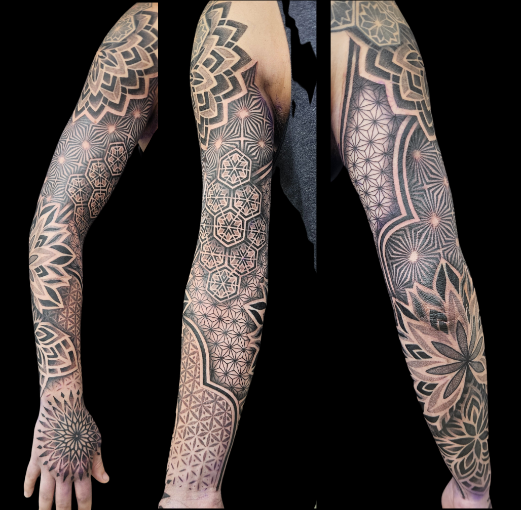 Geometric Mandala Black Sleeve tattoo on arm by Sandy at Lethal Ink Tattoo, Pattaya. Sandy specializes in Geometric, Dotwork, Blackwork, Fine Line. Geometric Mandala Black Sleeve tattoo on arm by Sandy, tattoo artist at Lethal Ink Tattoo, Pattaya (2025)