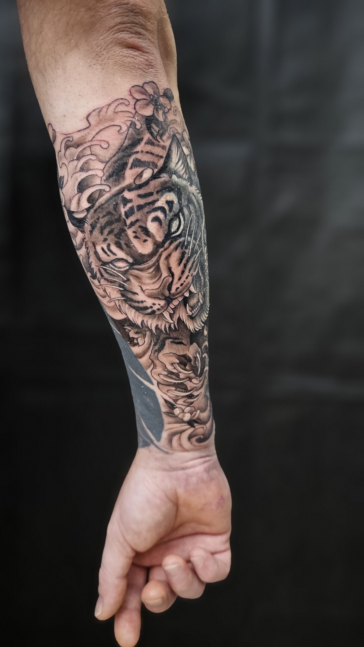 Tiger, animated, Japanese style, black and gray, arm tattoo Lethal Ink Tattoo, Phra Tamnak, Pattaya, 2025 Tiger, animated, Japanese style, black and gray, arm tattoo Lethal Ink Tattoo, Phra Tamnak, Pattaya, 2025