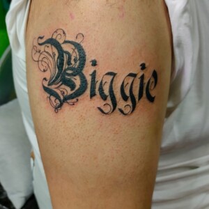 Biggie, Black, Arm Tattoo. We have highly skilled tattoo artists at Lethal Ink Tattoo in Pattaya. We are known for Japanese, Chicano, Realistic, New School, Old School, Neo Thai, Blackwork, and Bamboo Tattooing. Biggie, Black, Arm Tattoo, Lethal Ink, Pattaya, 2024