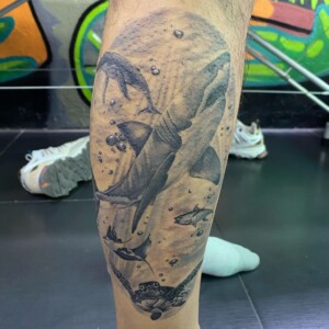 Under the Ocean, Shark, Black and Grey Tattoo. We have highly skilled tattoo artists at Lethal Ink Tattoo in Pattaya. We are known for Japanese, Chicano, Realistic, New School, Old School, Neo Thai, Blackwork, and Bamboo Tattooing. Under the Ocean, Shark, Black and Grey Tattoo, Lethal Ink, Pattaya, 2024