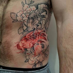 Japanese, Koi Fish, Rib Tattoo by Alek. She is a highly skilled tattoo artist at Lethal Ink Tattoo in Pattaya. She is celebrated for her expertise in Japanese, BlackWork, and Abstract styles. Alek, Japanese, Koi Fish, Rib Tattoo, Lethal Ink, Pattaya, 2024