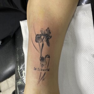 La liberte, Flower, Arm, Black Tattoo by Max. He is a highly skilled tattoo artist at Lethal Ink Tattoo in Pattaya. He is celebrated for is expertise in black and grey, anime, manga, Thai art, and tribal motifs. La liberte, Flower, Arm, Black Tattoo, Max, Lethal Ink, Pattaya, 2024