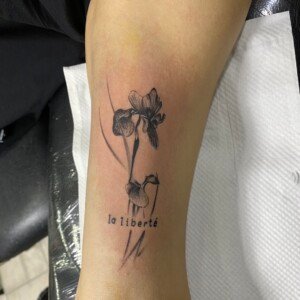 La liberte, Flower, Arm, Black Tattoo by Max. He is a highly skilled tattoo artist at Lethal Ink Tattoo in Pattaya. He is celebrated for is expertise in black and grey, anime, manga, Thai art, and tribal motifs. La liberte, Flower, Arm, Black Tattoo, Max, Lethal Ink, Pattaya, 2024
