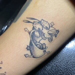 Ren, Cartoon, Black, Arm tattoo by Max. He is a highly skilled tattoo artist at Lethal Ink Tattoo in Pattaya. He is celebrated for is expertise in black and grey, anime, manga, Thai art, and tribal motifs. Ren, Cartoon, Black, Arm Tattoo, Max, Lethal Ink, Pattaya, 2024