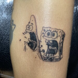 Spongebob, Patrick Black, Frightened tattoo by Max. He is a highly skilled tattoo artist at Lethal Ink Tattoo in Pattaya. He is celebrated for is expertise in black and grey, anime, manga, Thai art, and tribal motifs. Spongebob, Patrick Black, Frightened Tattoo, Max, Lethal Ink, Pattaya, 2024