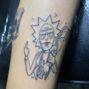 Rick, Scientist, Cartoon Black tattoo by Max. He is a highly skilled tattoo artist at Lethal Ink Tattoo in Pattaya. He is celebrated for is expertise in black and grey, anime, manga, Thai art, and tribal motifs. Rick, Scientist, Cartoon Black Tattoo, Max, Lethal Ink, Pattaya, 2024