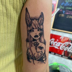 Sexy, Demon Girl, Black Tricep tattoo by Max. He is a highly skilled tattoo artist at Lethal Ink Tattoo in Pattaya. He is celebrated for is expertise in black and grey, anime, manga, Thai art, and tribal motifs. Sexy, Demon Girl, Black Tricep Tattoo, Max, Lethal Ink, Pattaya, 2024