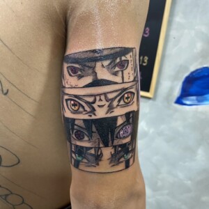 Anime, Face, Color, Tricep tattoo by Max. He is a highly skilled tattoo artist at Lethal Ink Tattoo in Pattaya. He is celebrated for is expertise in black and grey, anime, manga, Thai art, and tribal motifs. Anime, Face, Color, Tricep Tattoo, Max, Lethal Ink, Pattaya, 2024