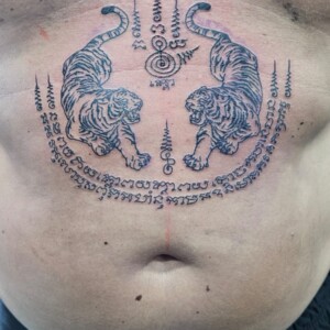 Sak Yant, Thai Traditional, Black, Stomach Tattoo by Toon. He is a highly skilled tattoo artist at Lethal Ink Tattoo in Pattaya. He is celebrated for his expertise in Japanese, Chicano, Realistic, New School, Old School, Neo Thai, and Bamboo Tattooing. Sak Yant, Thai Traditional, Black, Stomach Tattoo, Toon, Lethal Ink, Pattaya, 2024