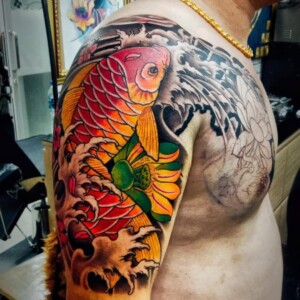 Koi Fish, Japanese Style, Half Arm Sleeve, Color Tattoo by Toon. He is a highly skilled tattoo artist at Lethal Ink Tattoo in Pattaya. He is celebrated for his expertise in Japanese, Chicano, Realistic, New School, Old School, Neo Thai, and Bamboo Tattooing. Koi Fish, Japanese Style, Half Arm Sleeve, Color, Toon Tattoo, Lethal Ink, Pattaya, 2024