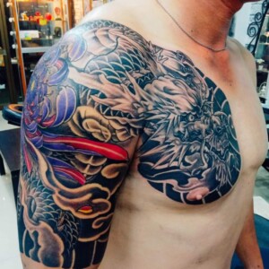 Japanese Style, Dragon, Black and Gray, Color, Chest Tattoo by Toon. He is a highly skilled tattoo artist at Lethal Ink Tattoo in Pattaya. He is celebrated for his expertise in Japanese, Chicano, Realistic, New School, Old School, Neo Thai, and Bamboo Tattooing. Japanese Style, Dragon, Black and Gray, Color, Chest, Toon Tattoo, Lethal Ink, Pattaya, 2024