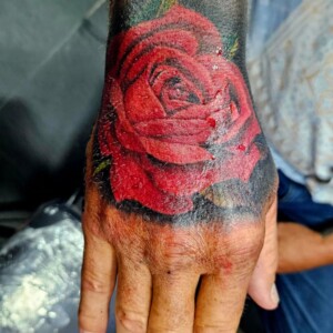 Rose, Red, Color, Realistic Style, Hand Tattoo by Toon. He is a highly skilled tattoo artist at Lethal Ink Tattoo in Pattaya. He is celebrated for his expertise in Japanese, Chicano, Realistic, New School, Old School, Neo Thai, and Bamboo Tattooing. Rose, Red, Color, Realistic Style, Hand Tattoo, Toon, Lethal Ink, Pattaya, 2024