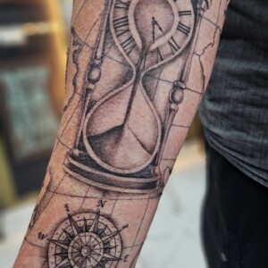 Hour glass, travel theme, black and gray, fine line, arm tattoo, Lethal Ink Tattoo, Phra Tamnak, Pattaya, 2025 Hour glass, travel theme, black and gray, fine line, arm tattoo, Lethal Ink Tattoo, Phra Tamnak, Pattaya, 2025