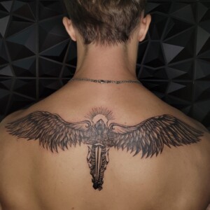 Black and grey angel wings tattoo on back by Apple at Lethal Ink Tattoo, Pattaya. Apple specializes in Black & Grey, Fine Line, Minimal, Script, Japanese, and Ornamental styles. Black and grey angel wings tattoo on back by Apple, tattoo artist at Lethal Ink Tattoo, Pattaya (2025)