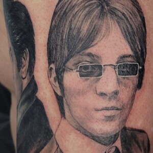 Realistic black and grey portrait tattoo on arm by Sandy at Lethal Ink Tattoo, Pattaya. Sandy specializes in Realism, Portrait, Black and Grey, Fine Detail, and Custom tattoos. Realistic black and grey portrait tattoo on arm by Sandy, tattoo artist at Lethal Ink Tattoo, Pattaya (2025)