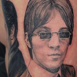 Realistic black and grey portrait tattoo on arm by Sandy at Lethal Ink Tattoo, Pattaya. Sandy specializes in Realism, Portrait, Black and Grey, Fine Detail, and Custom tattoos. Realistic black and grey portrait tattoo on arm by Sandy, tattoo artist at Lethal Ink Tattoo, Pattaya (2025)